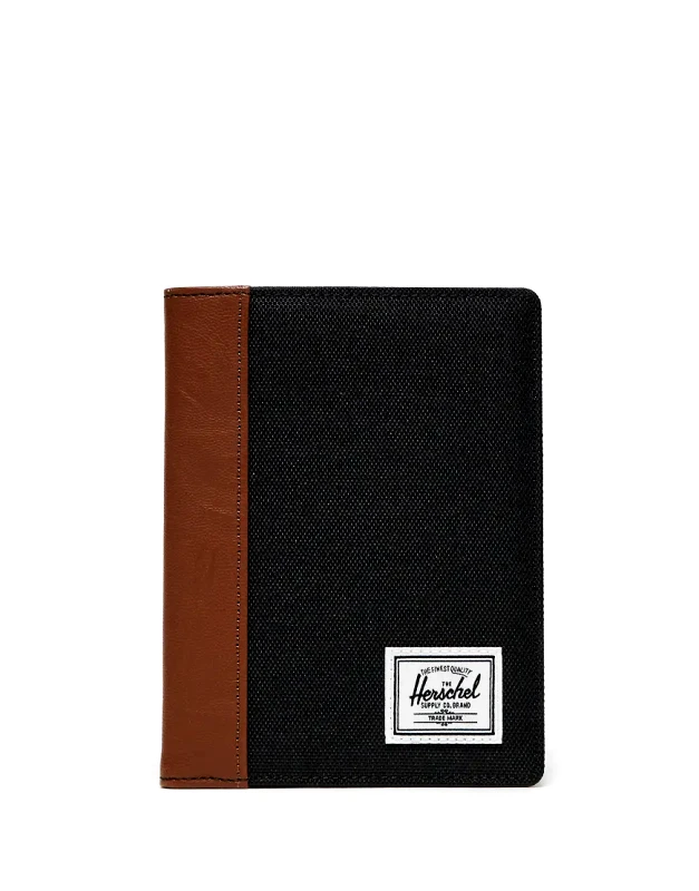 Herschel Supply Co Herschel Supply Co raynor passport holder in black/tan