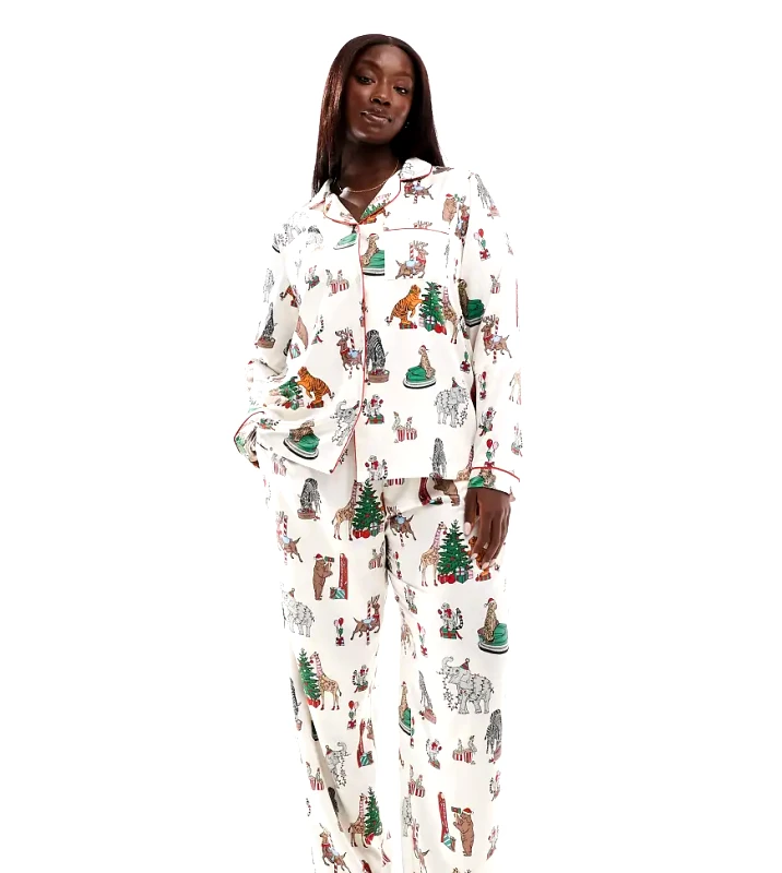 Chelsea Peers Chelsea Peers Curve Christmas satin circus print long sleeve top and trouser pyjama set in cream-White