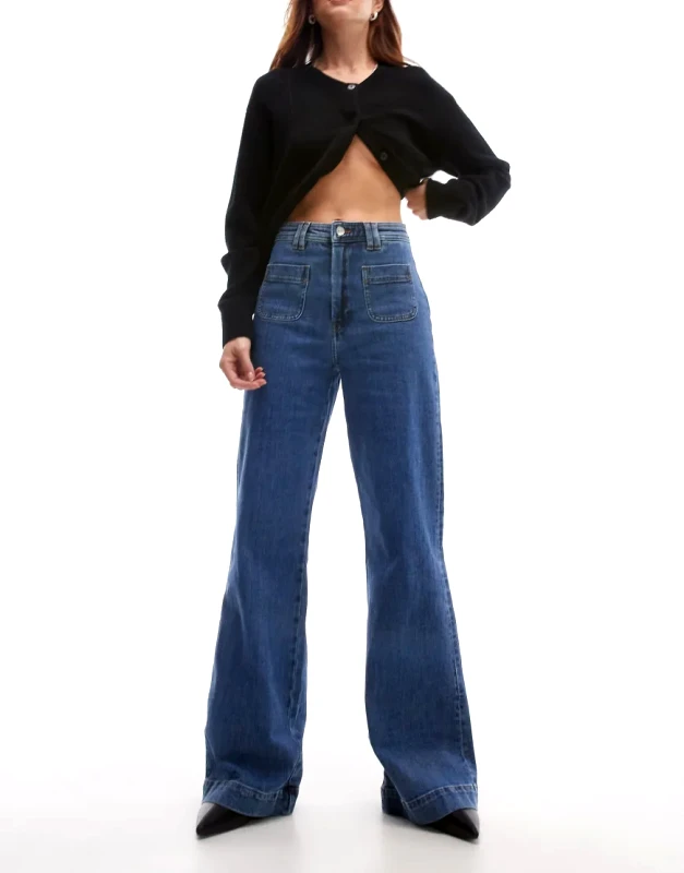 & Other Stories & Other Stories high rise flared jeans with patch pockets in mid blue wash